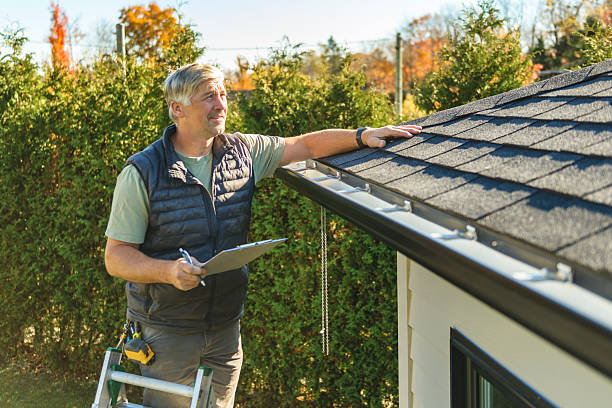 Professional Storm Damage Roof Repair technician working in Estero, FL